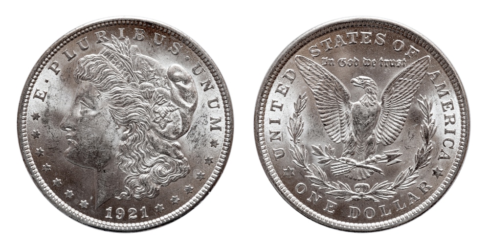 The obverse and reverse of a 1921 Morgan silver dollar.